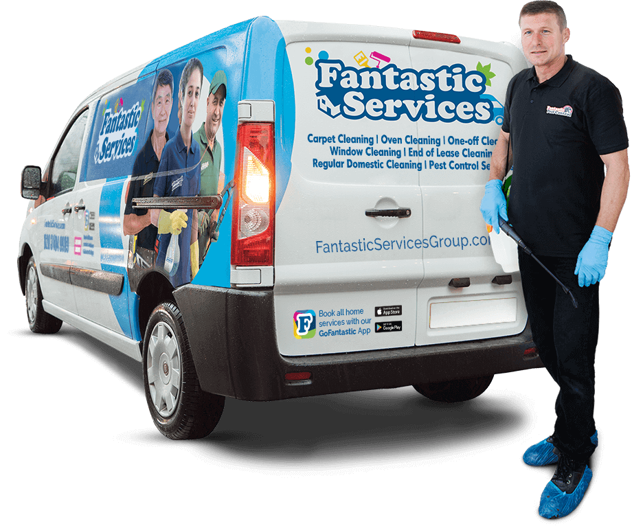 A Fantastic pest control expert in Melbourne standing in front of a branded van